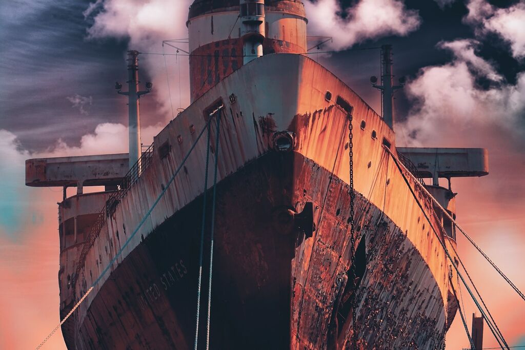 Rust, Barnacles, and Corrosion: Battling the Elements and Wear on Vessel Surfaces 2 low angle photo of brown boat