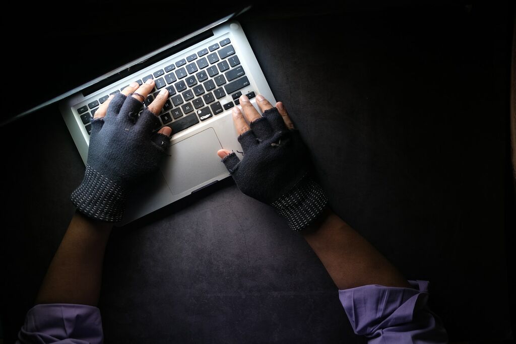 Phishing Attack in Troubled Waters: Safeguarding the Maritime Industry Against Cyber Deception 11 person in black long sleeve shirt using macbook pro