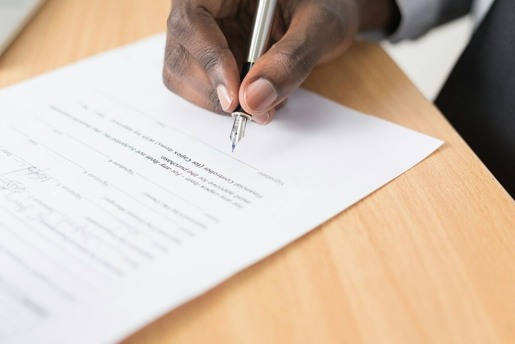 Customs Clearance Procedures in Indonesia: A Complete Guide for International Shippers 1 person writing on white paper