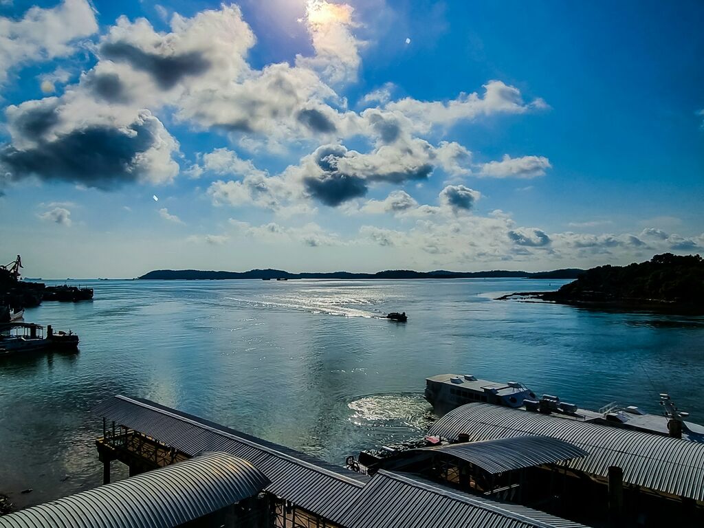 Batam Harbour Bay - Your International and Domestic Passenger Port 4 a body of water with boats and a cloudy sky